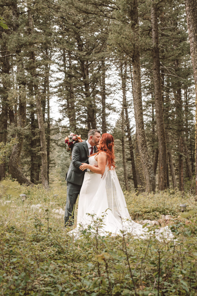 Newlyweds posing on the mountain