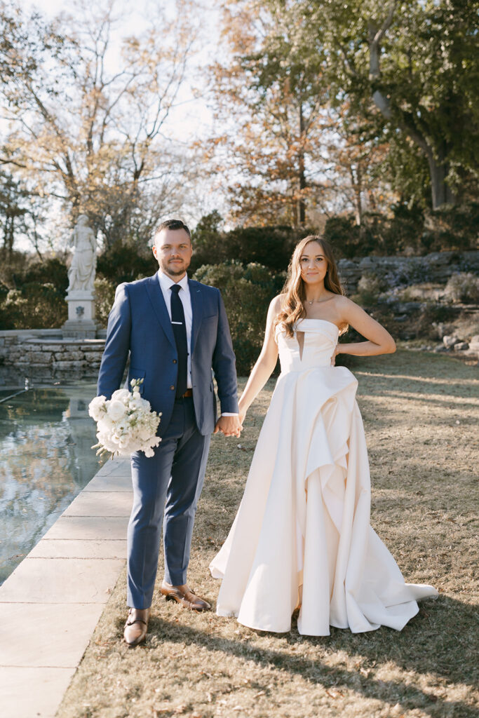 Bride and groom with flowers from their Nashville wedding florist