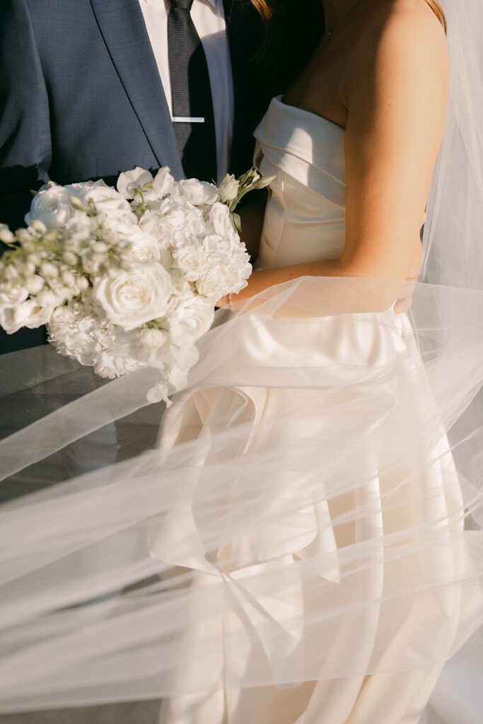 A classic white wedding bouquet with roses