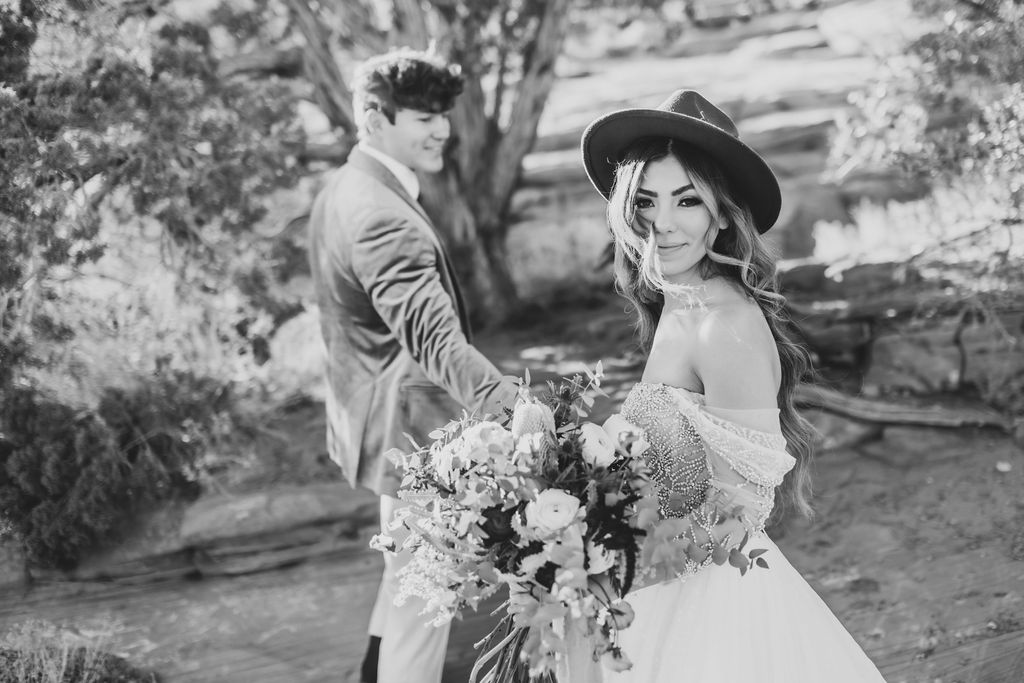 Newlyweds with wedding florals in the Tetons