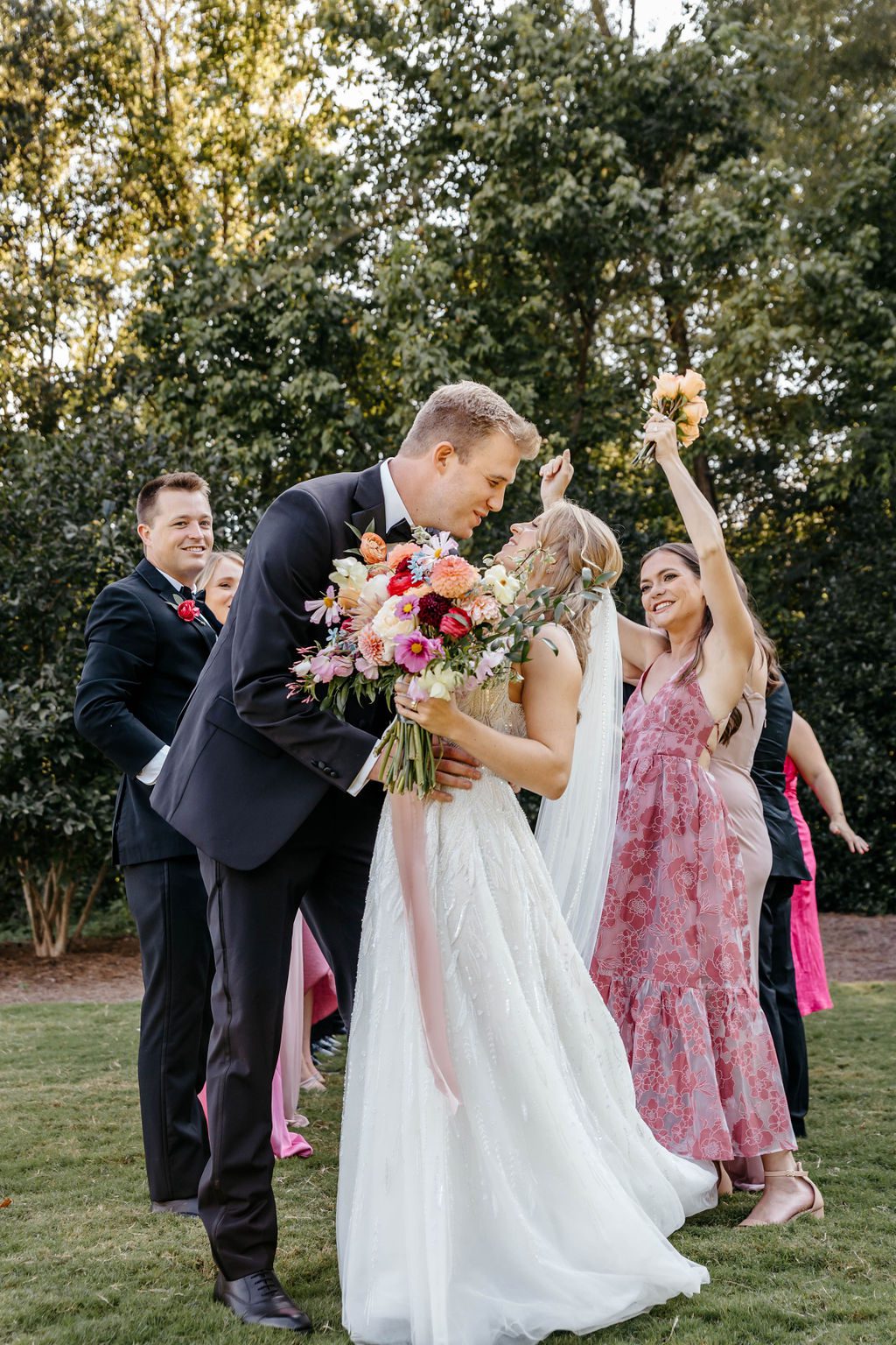 Cute couple in Nashville with their wedding flowers