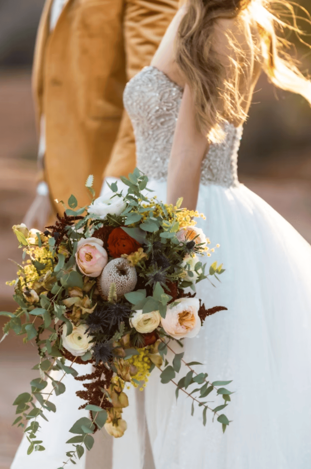 golden hour is such a special touch for glass house wedding venue florals